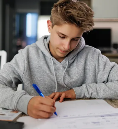 Teen with ADHD successfully focused on schoolwork using structured routines and coaching support