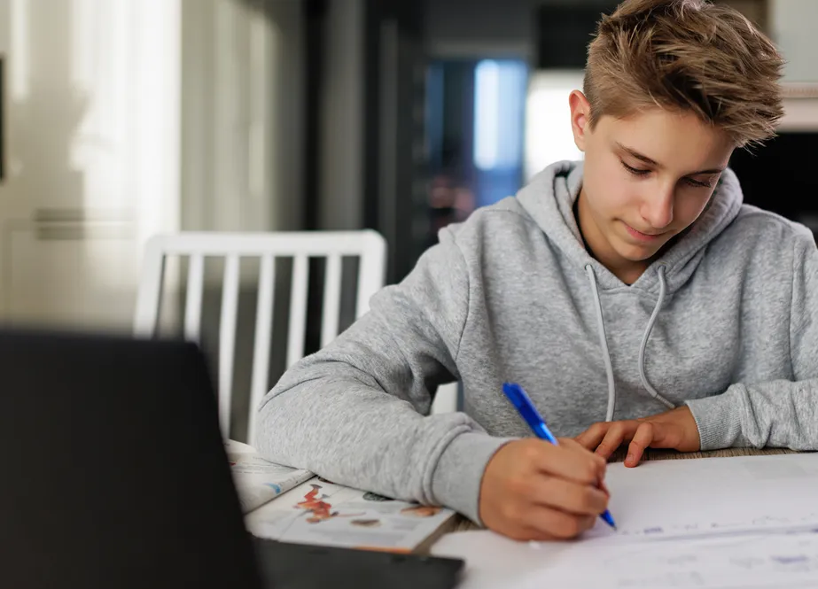 Teen with ADHD successfully focused on schoolwork using structured routines and coaching support