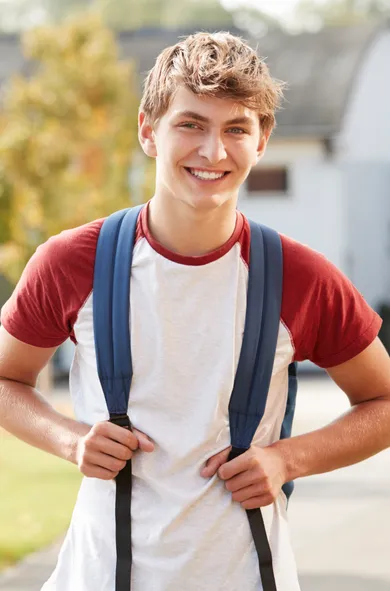 Confident teen student with improved organizational skills and time management after executive function coaching