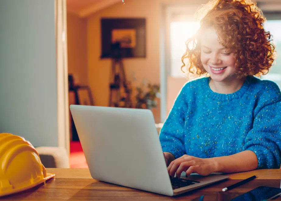 Teen working on laptop after receiving professional ADHD screening assessment and support
