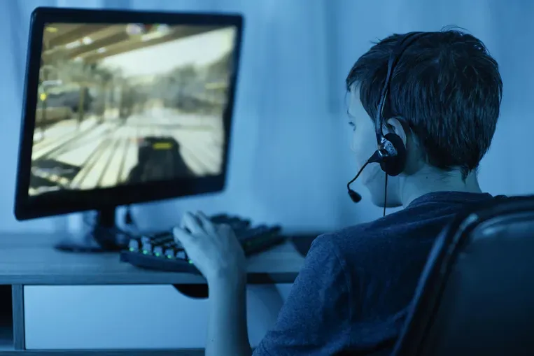Young boy playing computer games